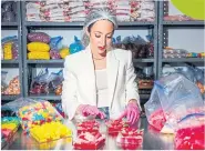  ?? ?? Elizabeth Schmitt making gummy ‘charcuteri­e’ boards for her company Ruby Bond, in Atlanta, on April 14.