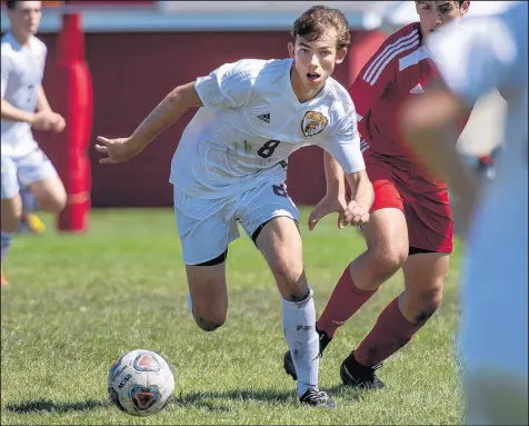  ?? MICHAEL GARD/POST-TRIBUNE ?? Chesterton senior Seth Conway, shown playing against Munster, transition­ed from a defender into a high-scoring forward.