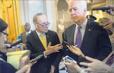  ?? Shawn Thew European Pressphoto Agency ?? SENS. CHARLES E. SCHUMER (D-N.Y.), left, and John Cornyn (R-Texas) after the vote. “We are overwhelmi­ngly grateful that Congress did not let us down,” said Terry Strada, a spokesman for Sept. 11 families.