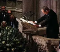  ?? AP/EVAN VUCCI ?? Former President George W. Bush (top photo) greets past and present presidents Wednesday before the start of his father’s funeral, then fights back tears (lower photo) as he delivers a eulogy at the service.