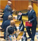  ?? Picture: GCIS ?? GOOD JOB. President Jacob Zuma is first in line to shake hands with Minister of Finance Pravin Gordhan yesterday.