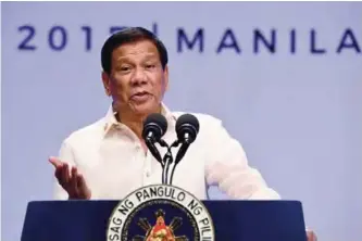  ??  ?? MANILA: This file photo shows Philippine­s’ President Rodrigo Duterte gesturing as he speaks during a press conference at the end of Associatio­n of Souteast Asian Nations (ASEAN) leaders’ summit in Manila. —AFP