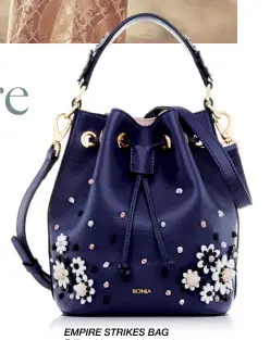  ??  ?? EMPIRE STRIKES BAG Brilliant blooms add a touch of whimsical romance and charm for this collection