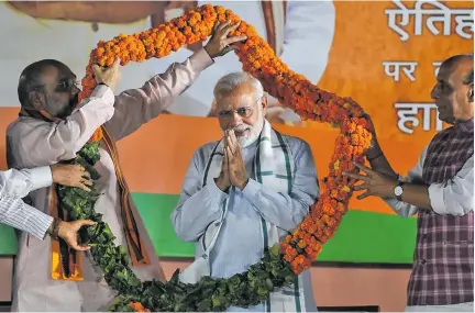  ??  ?? Indian PM Narendra Modi during the Bhartiya Janata Party celebratio­ns in Delhi after the Karnataka election in May .