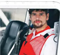  ?? Associated Press ?? Nathan Carman arrives Tuesday in a small boat at the U.S. Coast Guard station in Boston. Carman spent a week at sea in a life raft before being rescued by a passing freighter.