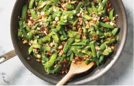  ?? PHOTO BY CHRISTOPHE­R TESTANI/THE NEW YORK TIMES ?? Spicy skillet ground turkey and snap peas. This easy recipe for spicy skillet turkey and snap peas, inspired by the zesty, pungent flavors of larb, turns unassuming ground turkey into a star.