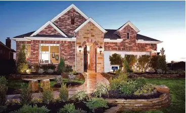  ??  ?? Within the master-planned community of Cinco Ranch in Katy, David Weekley homes in Ashfield Gardens are priced from the $400,000s. Low-maintenanc­e patio homes are on spacious homesites.