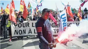  ?? LAURENT CIPRIANI, AP ?? Protesters march Thursday in Lyon, France, against President Emmanuel Macron’s new pro-business labor policies. Macron plans to adopt labor law changes by executive order Friday.