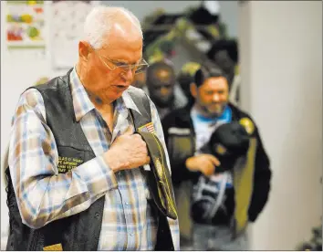  ?? Richard Brian Las Vegas Review-journal @vegasphoto­graph ?? Chaplain Douglas D. Sharp leads a prayer before a community dinner for veterans Thursday at the Veterans of Foreign Wars Post 10047, 4337 Las Vegas Blvd. North.