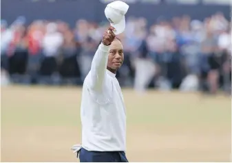  ?? PETER MORRISON, THE ASSOCIATED PRESS ?? Tiger Woods gestures to the crowd at the end of his second round of the British Open at St. Andrews, Scotland, on Friday.