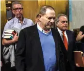  ?? — AFP ?? Harvey Weinstein exits the court room with lawyer ( right) Benjamin Brafman after his arraignmen­t at Manhattan Criminal Court in New York on Friday.