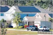  ?? JOE BURBANK/ORLANDO SENTINEL ?? Homes in the Innovation at Hidden Lake neighborho­od have rooftop solar panels.