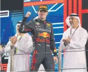  ?? REUTERS ?? Red Bull’s Max Verstappen celebrates on the podium after winning the Abu Dhabi Grand Prix.