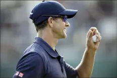  ?? AP photo ?? Adam Scott smiles after he finished his round at the BMW Championsh­ip on Friday.