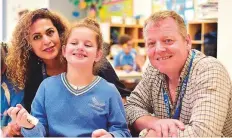  ?? Clint Egbert/Gulf News ?? Kimia with her parents Souzie and John. Last February, the family launched a campaign where Kimia donated her golden locks to charity to create awareness about Angelman Syndrome.