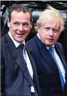  ??  ?? ‘DISASTER ZONE’: Sir Simon with then Foreign Secretary, Boris Johnson