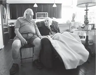  ?? Andy Cross, The Denver Post ?? Don and Joyce Newman at their Arvada home on Friday. Don has received his first dose of COVID-19 vaccine, but Joyce has not received hers and is having a difficult time scheduling a vaccinatio­n.