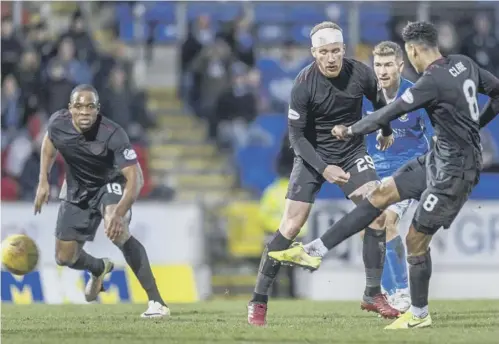  ??  ?? 0 Sean Clare rifles home Hearts’ equaliser in added time to rescue a point against St Johnstone at Mcdiarmid Park on Saturday.