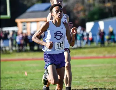  ?? Photos by Jerry Silberman / risportsph­oto.com ?? St. Raphael standout Nasavell Medeiros, above, rebounded from a tough Class C meet to earn a spot at New Englands by finishing a Valley-best 14th at Sunday’s state meet. The Saints finished 11th as a team.
