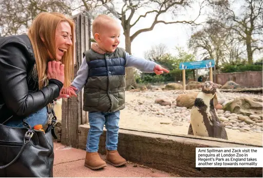  ??  ?? Ami Spillman and Zack visit the penguins at London Zoo in Regent’s Park as England takes another step towards normality