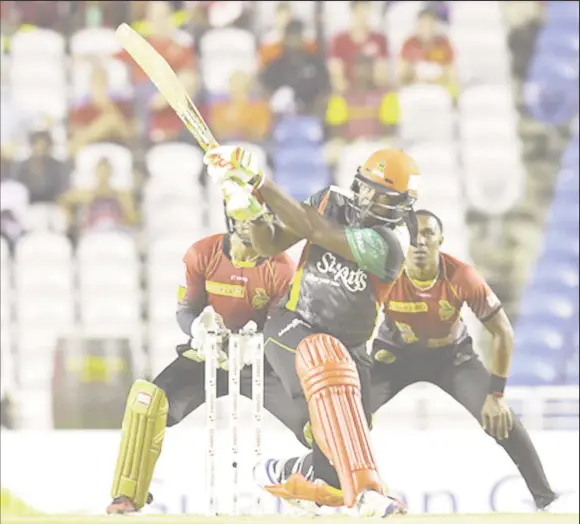  ??  ?? Chris Gayle held the St Kitts and Nevis Patriots innings together with an unbeaten knock of 54. A bove he hits a 6 during the Play Off Match of the 2017 Hero Caribbean Premier League between St Kitts & Nevis Patriots and Trinbago Knight Riders at Brian...