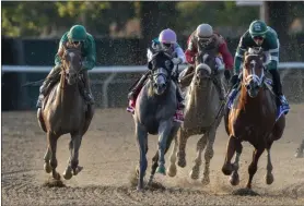  ?? ELSA LORIEUL/NYRA ?? Code of Honor (outside) with John Velazquez up along with Vino Rosso (inside) with Irad Ortiz Jr. up turn for the stretch in Saturday’s Jockey Club Golf Cup at Belmont Park.