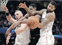  ?? [TONY DEJAK/THE ASSOCIATED PRESS] ?? Cleveland’s Tristan Thompson, center, fights for the ball with Washington’s Marcin Gortat, left, and Markieff Morris during Thursday’s game.