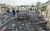  ?? The Associated Press ?? ■ In this photo provided by Guyana’s Department of Public Informatio­n, the dormitory of a secondary school is shown Monday after a fire in Mahdia, Guyana.