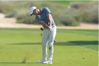  ?? (AP photo/Kamran Jebreili) ?? Rory McIlroy of Northern Ireland plays his second shot on the 16th hole Jan. 30 during the final round of the Dubai Desert Classic, in Dubai, United Arab Emirates.