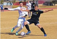  ?? JIM THOMPSON/JOURNAL ?? New Mexico United’s Santi Moar, right, and Denver’ Stefan DeLeon battle for possession during Saturday’s exhibition game at the UNM Soccer and Track Complex. United won its first-ever game, 1-0.