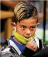  ?? Bob Owen / Staff photograph­er ?? First-grader Harvey Hernandez swabs his nose for a test at Barrera Veterans Elementary School.