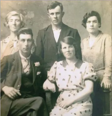  ??  ?? Julia Murphy (back, left), whose stories of 1798 are preserved in a recording from 1971, pictured in the 1930s at the wedding of Michael Fortune’s grandparen­ts, Michael and Jane (at front), with James Quinsey and Annie O’Brien.