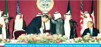  ??  ?? Kuwait’s late Amir Sheikh Jaber Al-Ahmad Al-Jaber Al-Sabah awards the Order of Mubarak the Great to former US President George HW Bush in 1993.