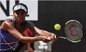  ?? — AP ?? Back to you: Venus Williams of the United States returns a shot to Britain’s Johanna Konta during the third round of the Italian Open in Rome on Thursday.