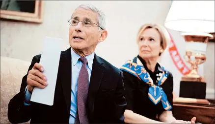  ?? MANDEL NGAN/GETTY-AFP ?? Dr. Anthony Fauci and Dr. Deborah Birx have had to walk a fine line amid President Trump’s mixed messaging to Americans on the coronaviru­s.