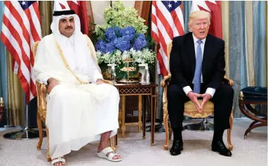  ?? PICTURE: AP ?? DIFFERENT VIEWS: US President Donald Trump, right, at a meeting with Qatar’s Emir, Sheikh Tamim Bin Hamad Al-Thani, in Riyadh, Saudi Arabia, last month. Trump at first sided with Saudi Arabia and other Arab countries against Qatar earlier this week in...