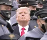  ?? AP ?? Surrounded by Army cadets, President Donald Trump watches the Army- Navy football game earlier this month at Michie Stadium in West Point, N. Y.