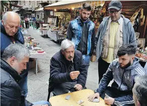  ?? — THE ASSOCIATED PRESS ?? Conversing with the vendors of the Vucciria street market is a fantastic way to get a feel for the real Palermo.