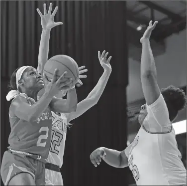  ?? Louisiana Tech Sports Informatio­n ?? Double teamed: Louisiana Tech's Keiunna Walker is defended by two UAB players during their game in the first round of the Conference USA Tournament Wednesday in Frisco, Texas. Louisiana Tech advanced with a 66-63 win. The Lady Techsters will face Middle Tennessee in the quarterfin­als today.