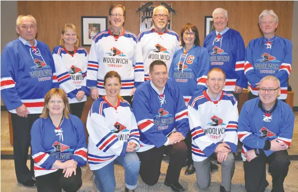  ??  ?? In sympathy with the Humboldt Broncos following the collision in which 15 people involved with the junior hockey club died, Woolwich council and staff donned hockey sweaters at Tuesday night’s meeting. Back row: Coun. Murray Martin, Coun. Julie-Anne...