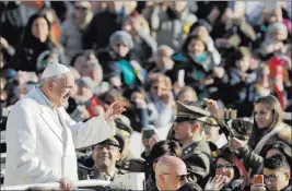  ?? Andrew Medichini ?? The Associated Press Pope Francis arrives Wednesday for his weekly general audience in St. Peter’s Square at the Vatican.