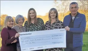  ?? ?? From left, Denise Hodges of LASAG receives a cheque for £8,549 from Sandra Danton, daughters Claire Packman and Natalie Collins, and 2022 Canterbury Golf Club captain Scott Lindsay