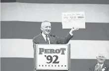  ?? PHOTO BY BOB GALBRAITH/AP ?? Independen­t candidate Ross Perot waves a copy of the 1948 Chicago Daily Tribune newspaper proclaimin­g Thomas Dewey the winner over Harry Truman in that year’s presidenti­al election. 1992