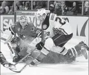  ?? Marcio Jose Sanchez
Associated Press ?? DUCKS’ Shawn Horcoff (22) has his shot blocked by San Jose’s Brent Burns (88) during the second period.