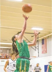  ?? NICK SANCHEZ/FOR THE NEW MEXICAN ?? Pecos’ Cassie Muller shoots Thursday against the Desert Academy/Santa Fe Waldorf team in Santa Fe. Pecos won 58-15 and coach Ron Drake got his 600th win.