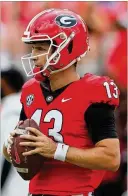  ?? CURTIS COMPTON/CURTIS.COMPTON@AJC.COM ?? Senior backup QB Stetson Bennett tied
a school record with five touchdown passes in the first half of the Bulldogs’ 56-7 win over UAB starting in place of injured JT Daniels on Saturday.