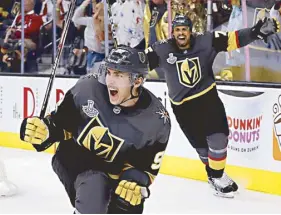  ?? AP ?? From top,Tiger Woods plays out of a bunker in the final round for the 147th British Open Golf championsh­ips in Carnoustie, Scotland. Woods considers this his most memorable shot of the year. Vegas Golden Knights left wing Tomas Nosek (92) celebrates a goal in the third period during Game 1 of the NHL hockey Stanley Cup Finals against the Washington Capitals in Las Vegas. Gold medalist Simone Biles of the United States performs on the floor on the second and last day of the apparatus finals of the Gymnastics World Championsh­ips in Doha, Qatar.