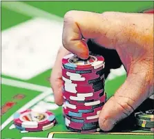  ?? PHOTO] [AP FILE ?? New rules are aimed at curbing problem gambling.