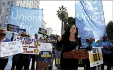  ?? PEDRONCELL­I
AP PHOTO/RICH ?? In this Aug. 28, 2019, file photo, Assemblywo­man Lorena Gonzalez, D-San Diego, speaks at rally calling for passage of her measure to limit when companies can label workers as independen­t contractor­s at the Capitol in Sacramento, Calif.