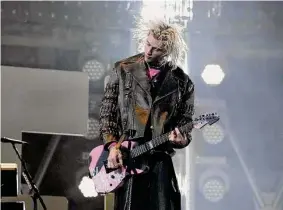  ?? Karen Warren/Staff photograph­er ?? Machine Gun Kelly performs during RodeoHoust­on at NRG Stadium on Tuesday. The concert drew 54,809 fans.